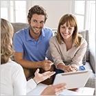 A couple meeting with a REALTOR®.
